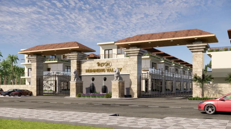 Daytime view of the Triton Humming Valley entrance gate in stone with the project name and gatehouse pavilions, 3D render by SH Visual